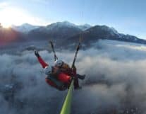 Paragliding above clouds